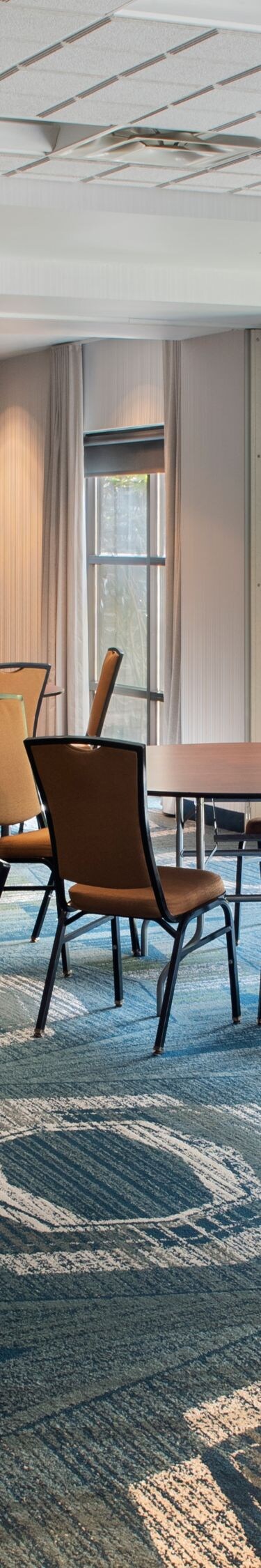 Meeting space with round tables and chairs