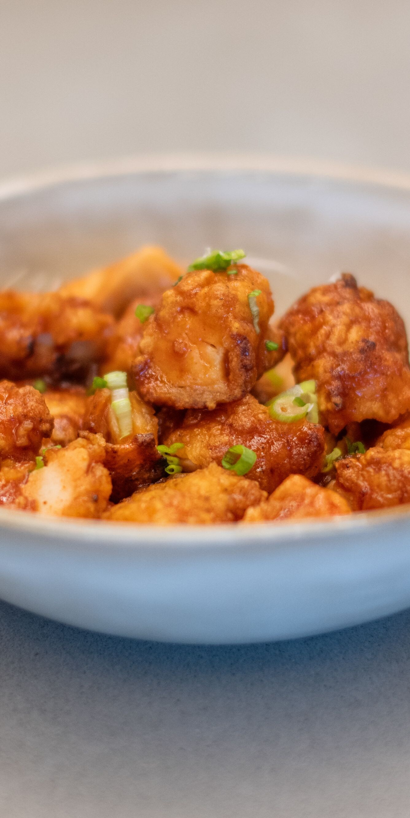 Bowl of sweet and spicy chicken bites appetizer