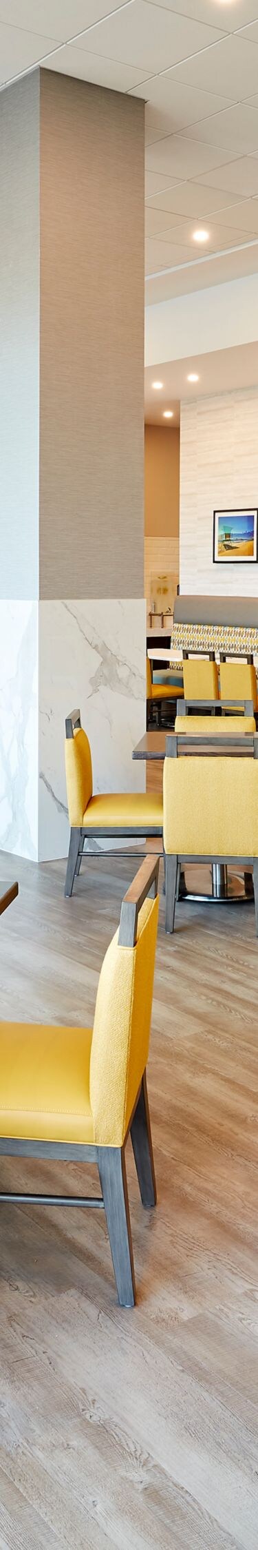 Breakfast seating area with dining tables