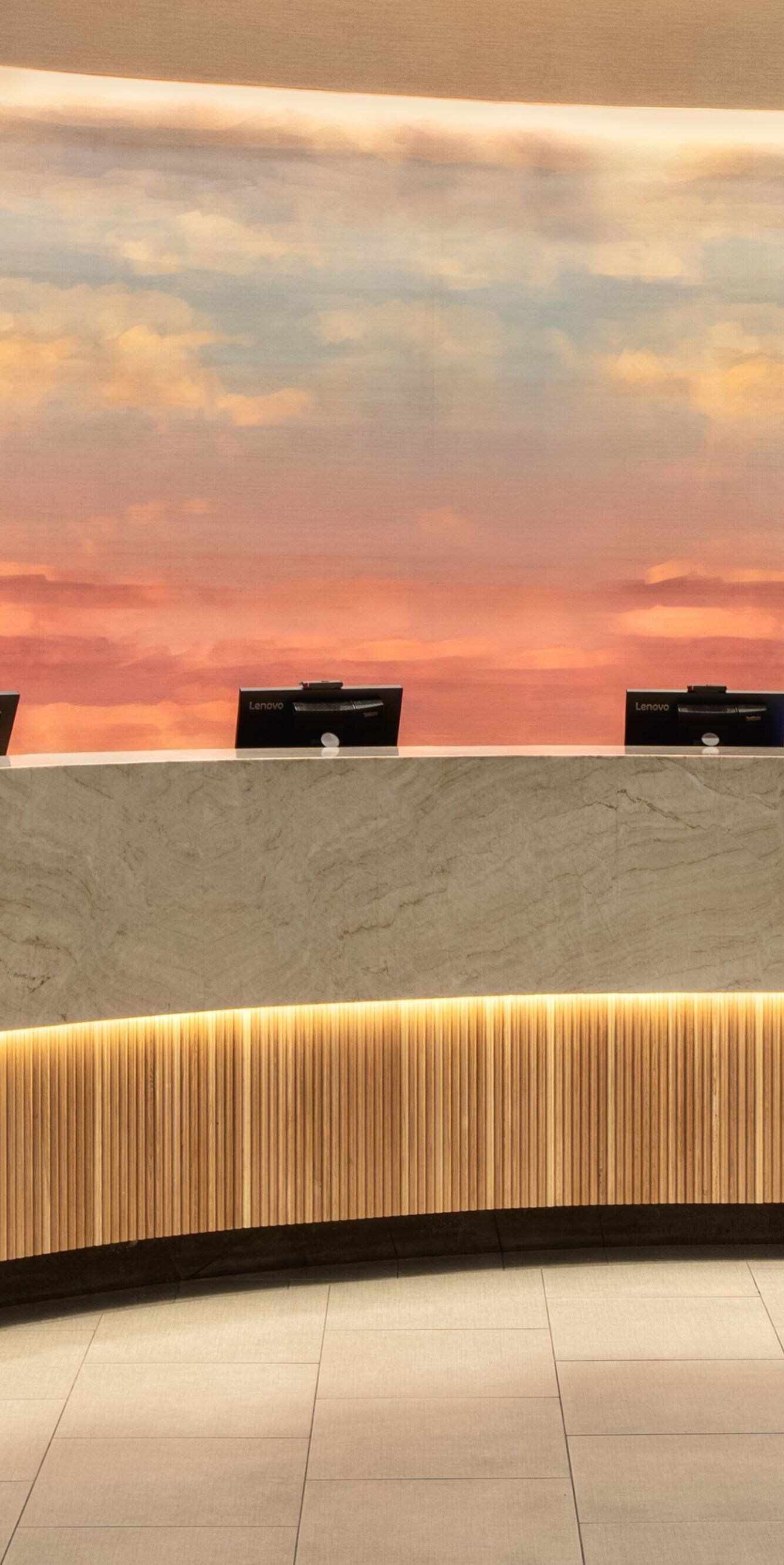 Curved reception desk with accent lighting