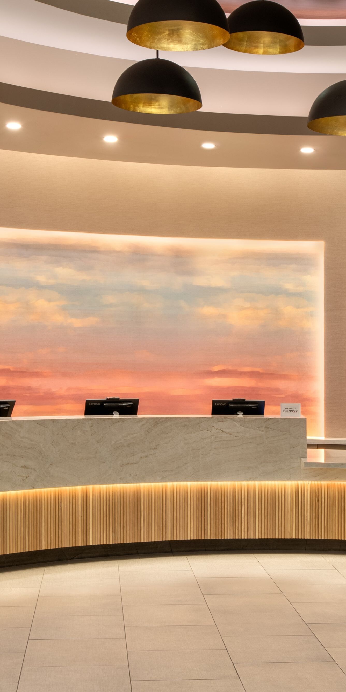 Reception desk with illuminated backdrop
