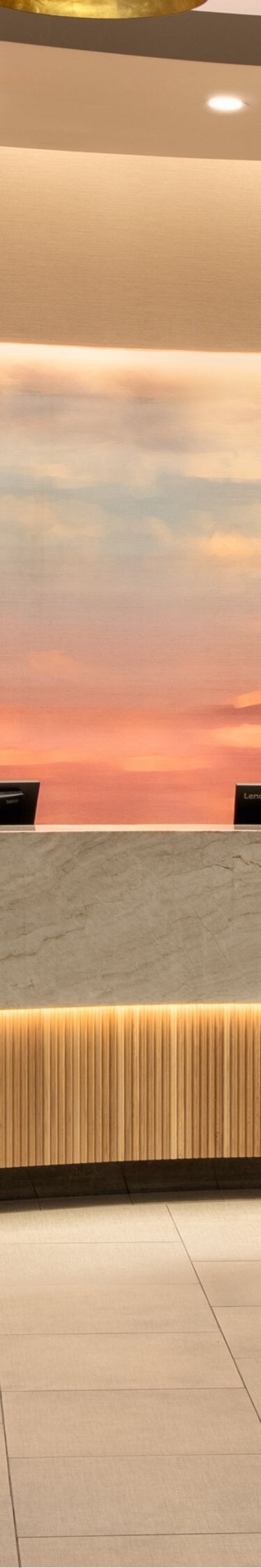 Reception desk with illuminated backdrop
