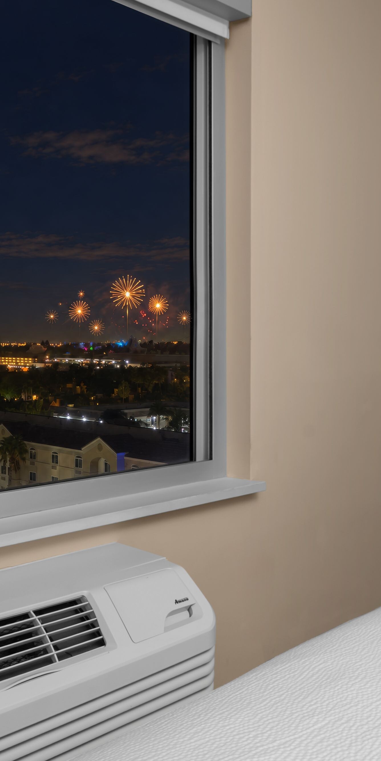 Nighttime fireworks seen from guest room window