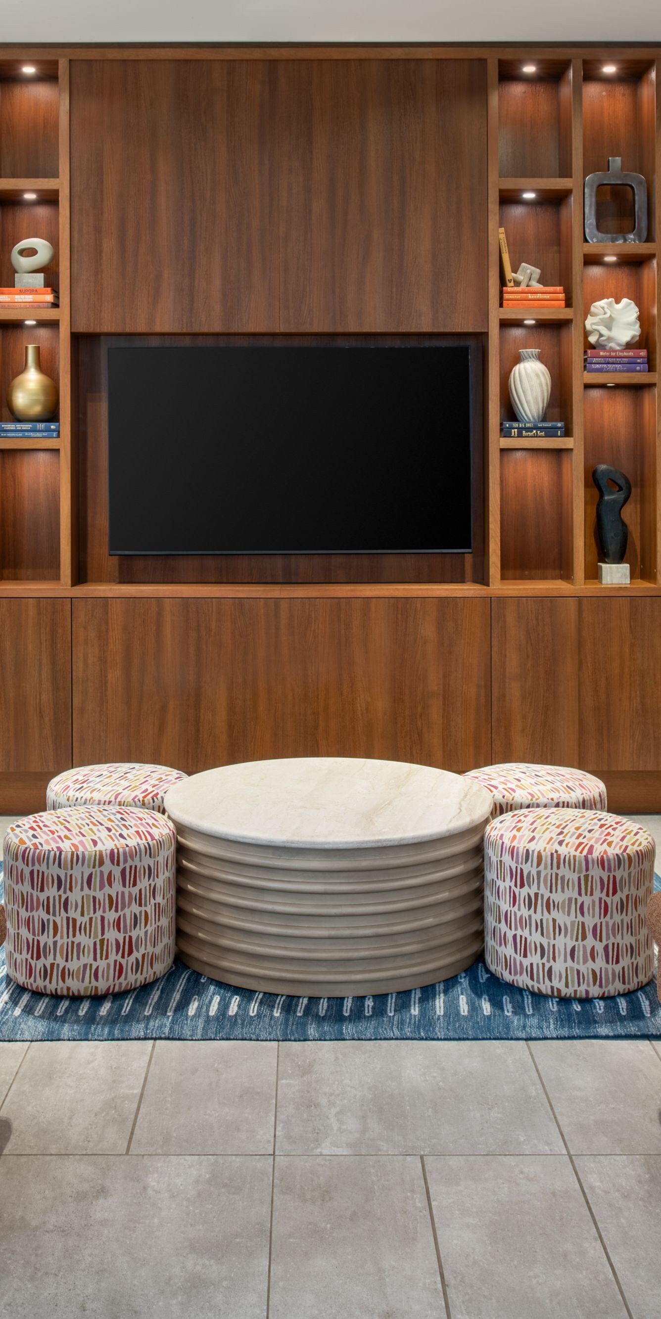 Lounge chairs near media wall