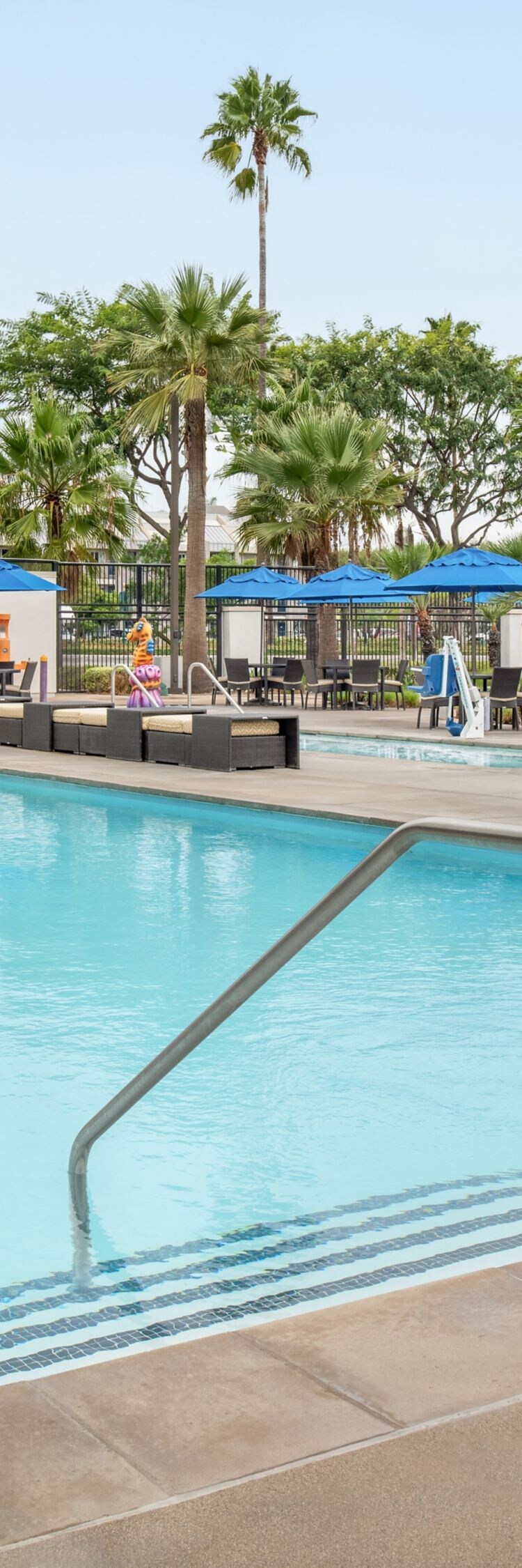 Outdoor pool with loungers