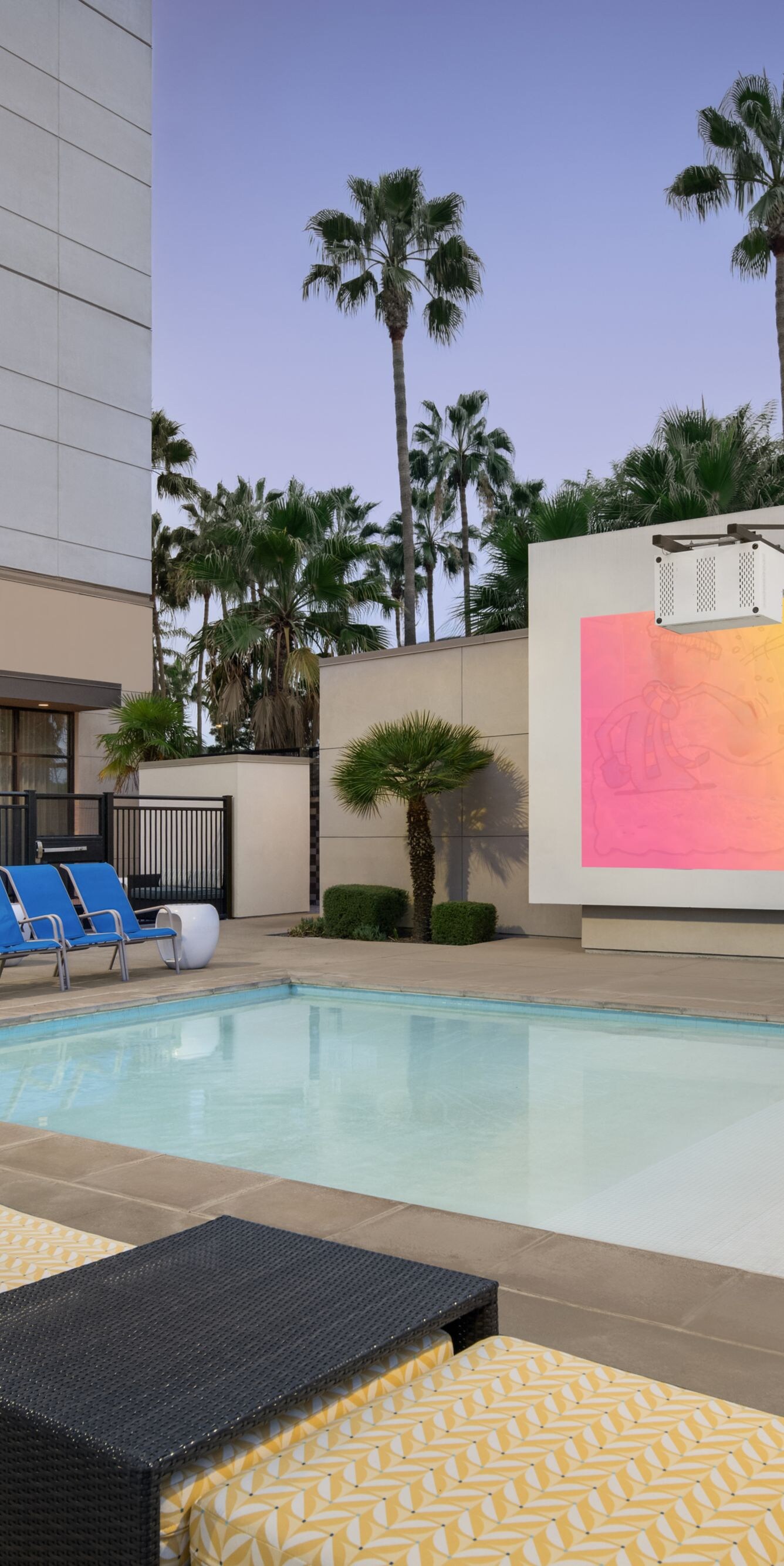 Outdoor Pool with lounge chairs and movie screen