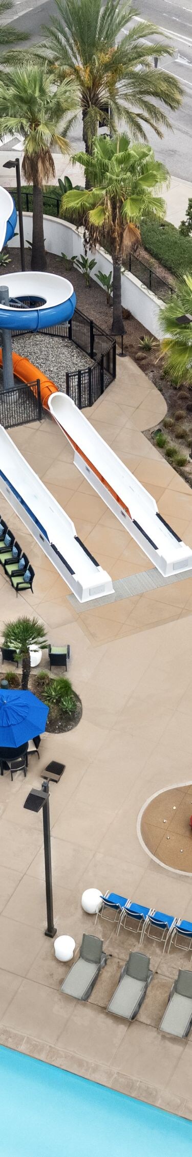 Overhead view of pools, pool seating, and slide