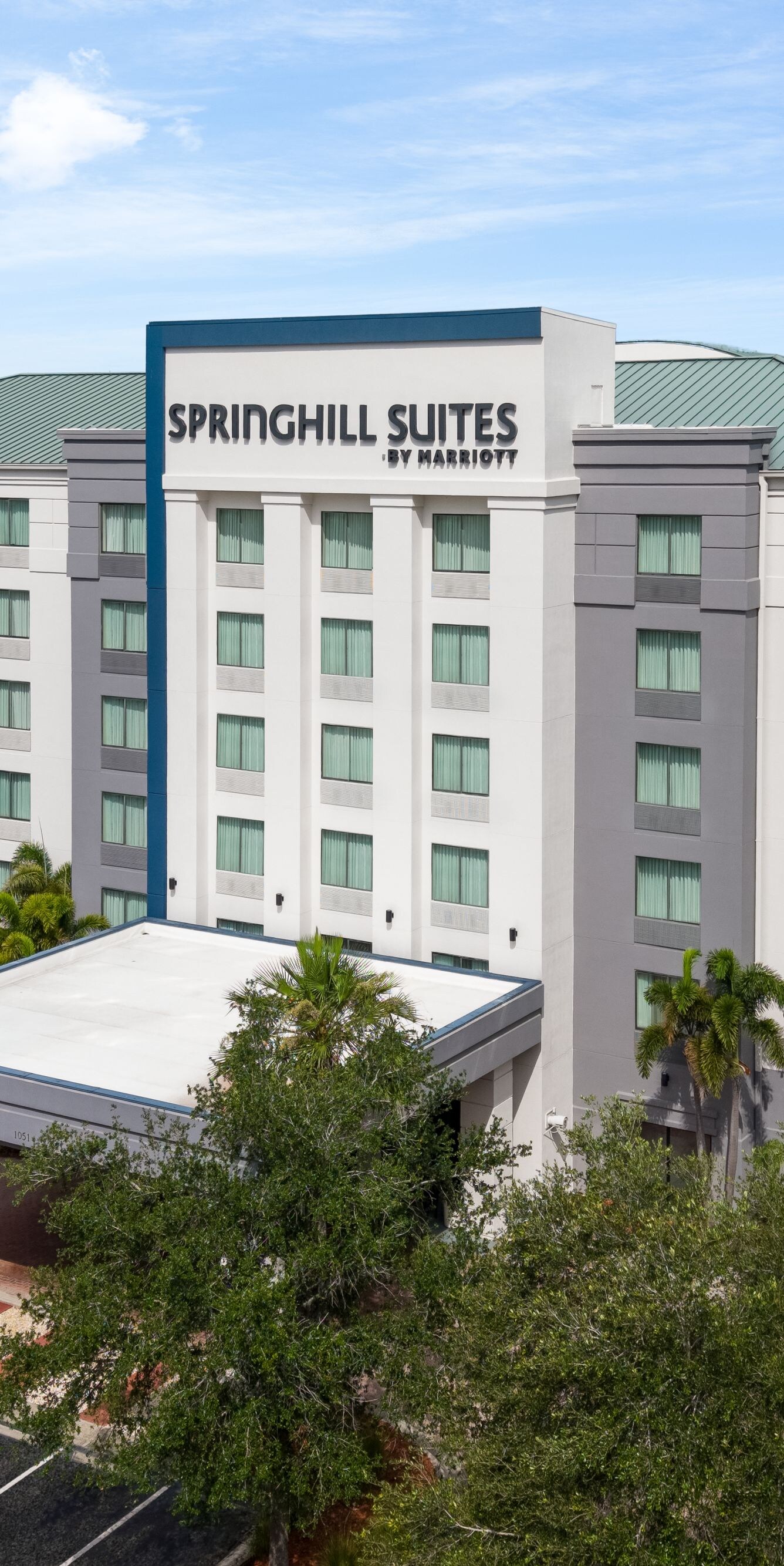 Drone view of hotel exterior in daylight