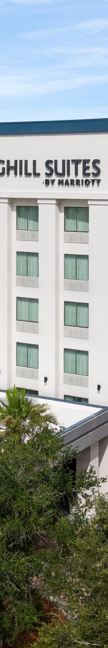Drone view of hotel exterior in daylight