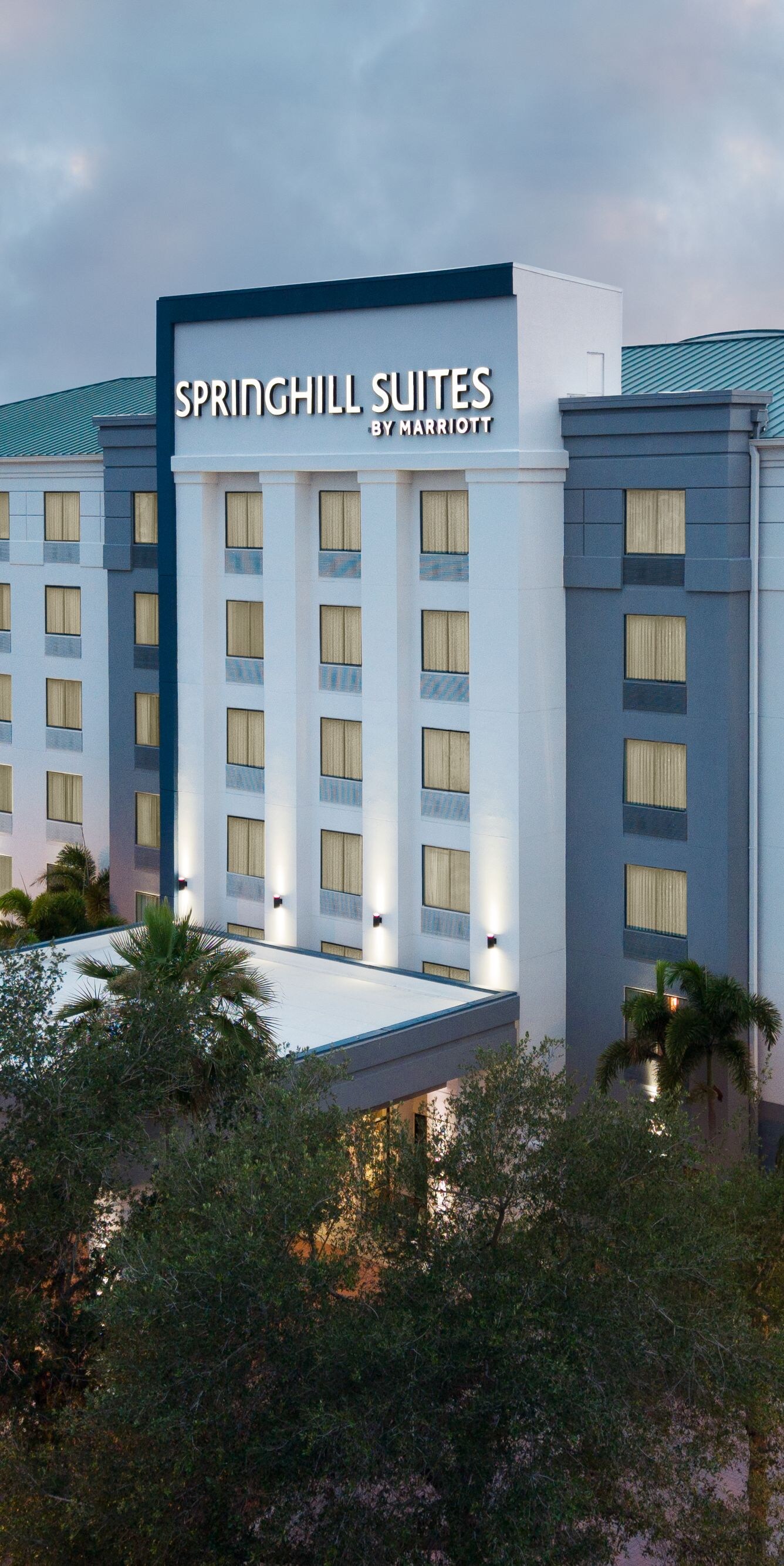 Drone shot of hotel exterior at dusk