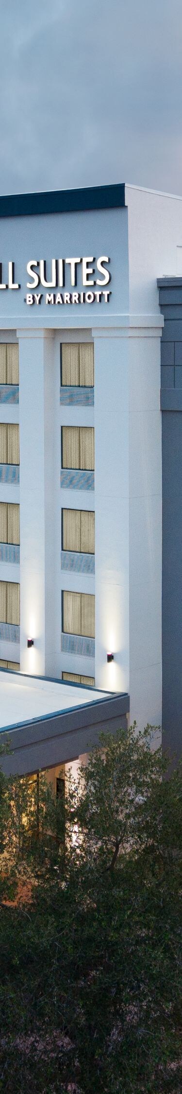 Drone shot of hotel exterior at dusk
