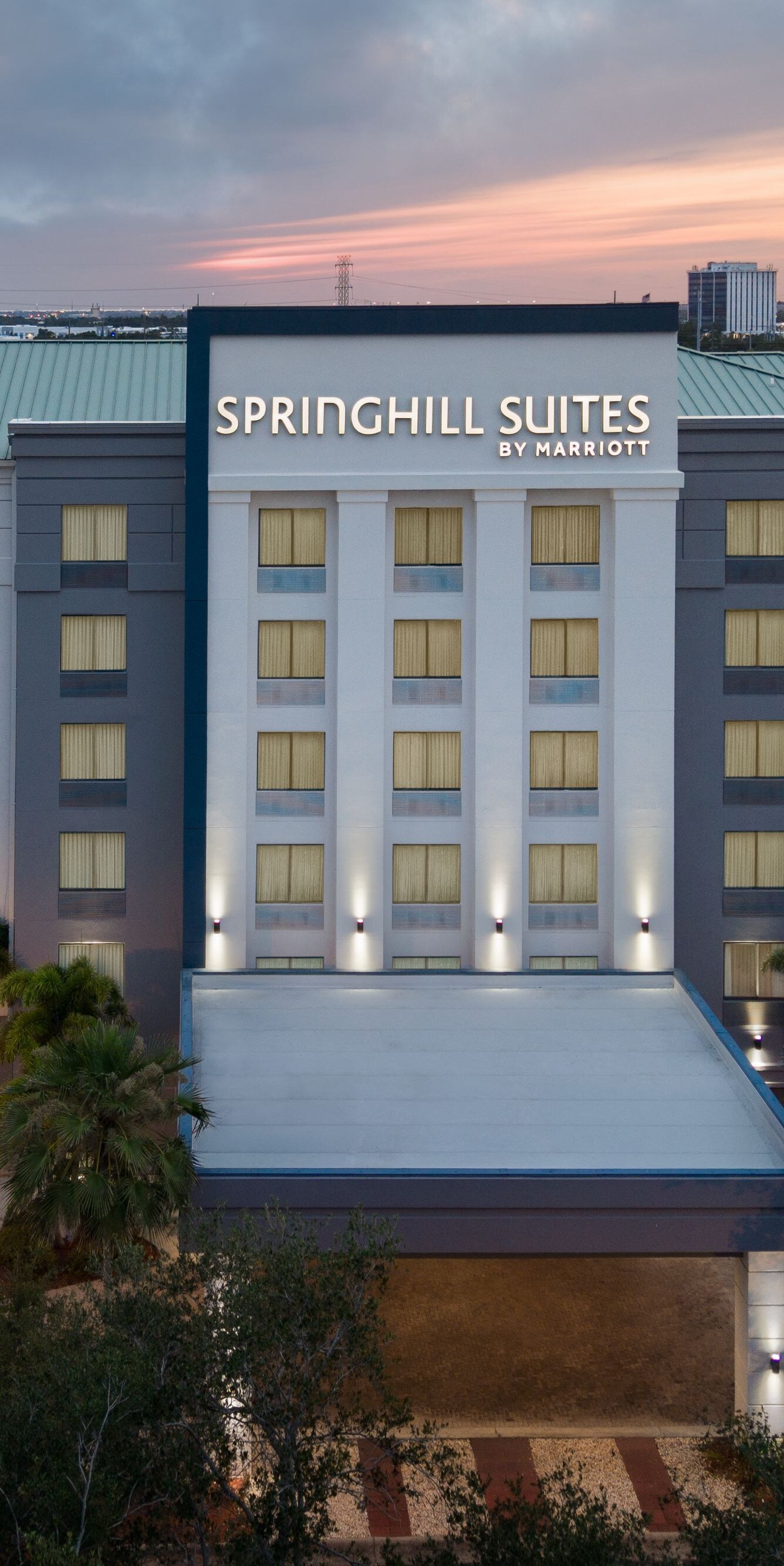 Drone shot of hotel exterior at dusk