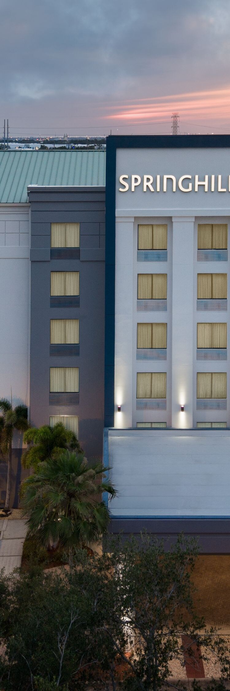 Drone shot of hotel exterior at dusk