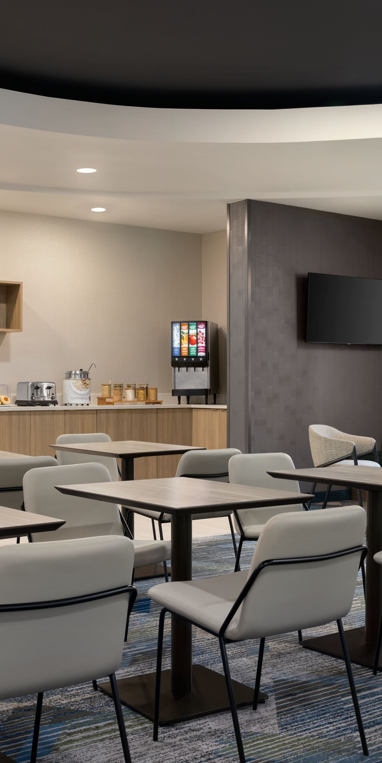 tables and chairs in a dining space