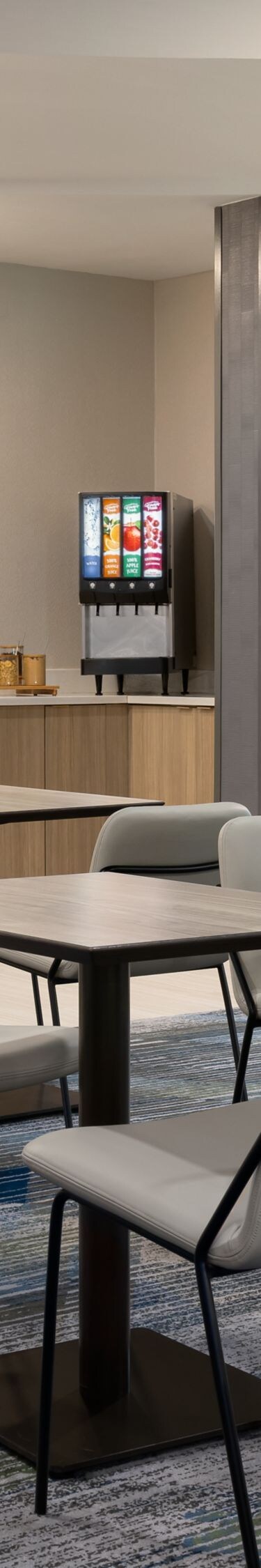 tables and chairs in a dining space