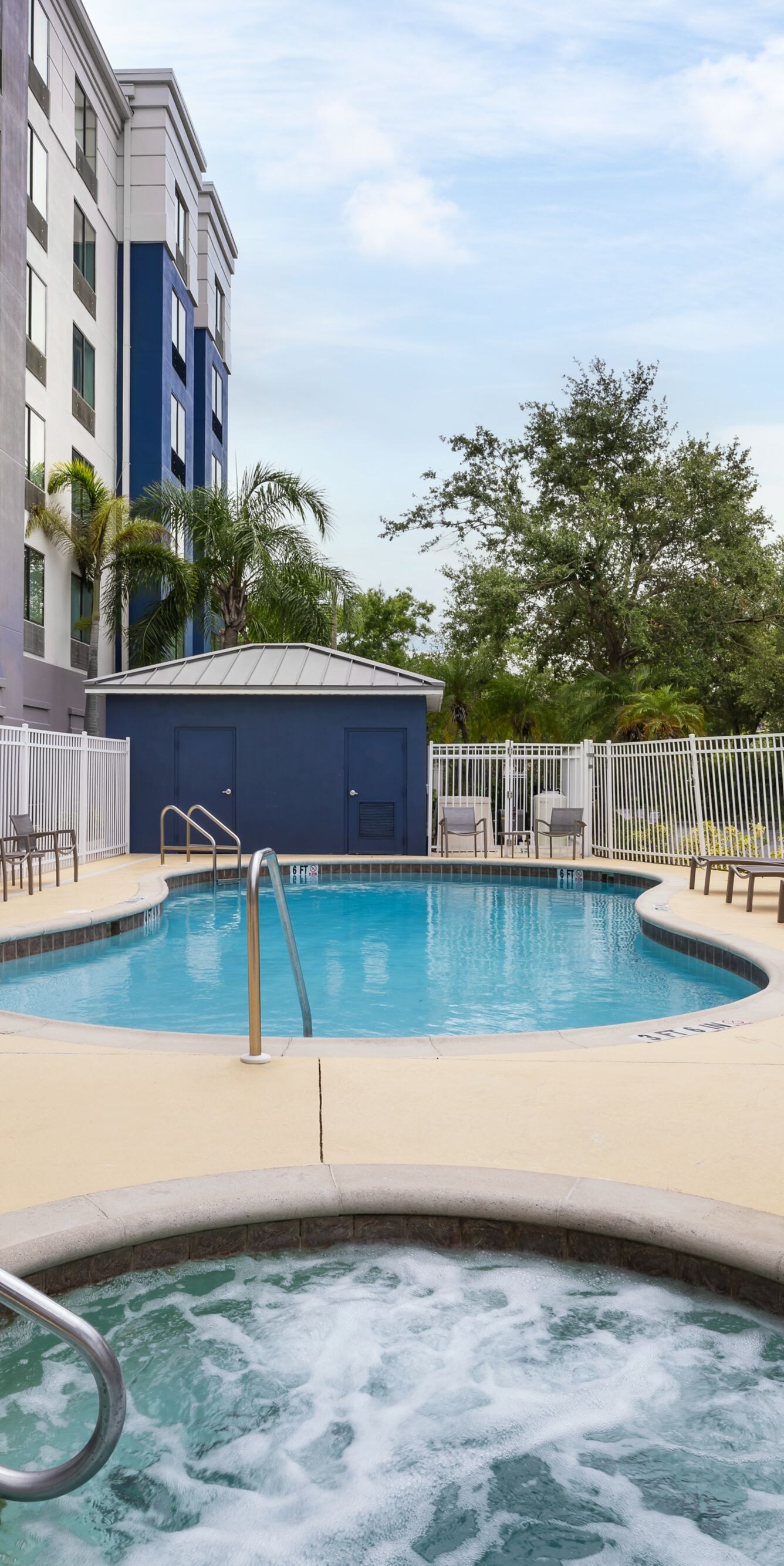 Outdoor pool and hot tub with accessible lift