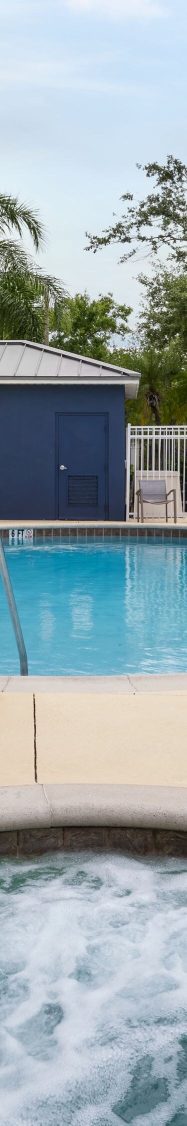 Outdoor pool and hot tub with accessible lift