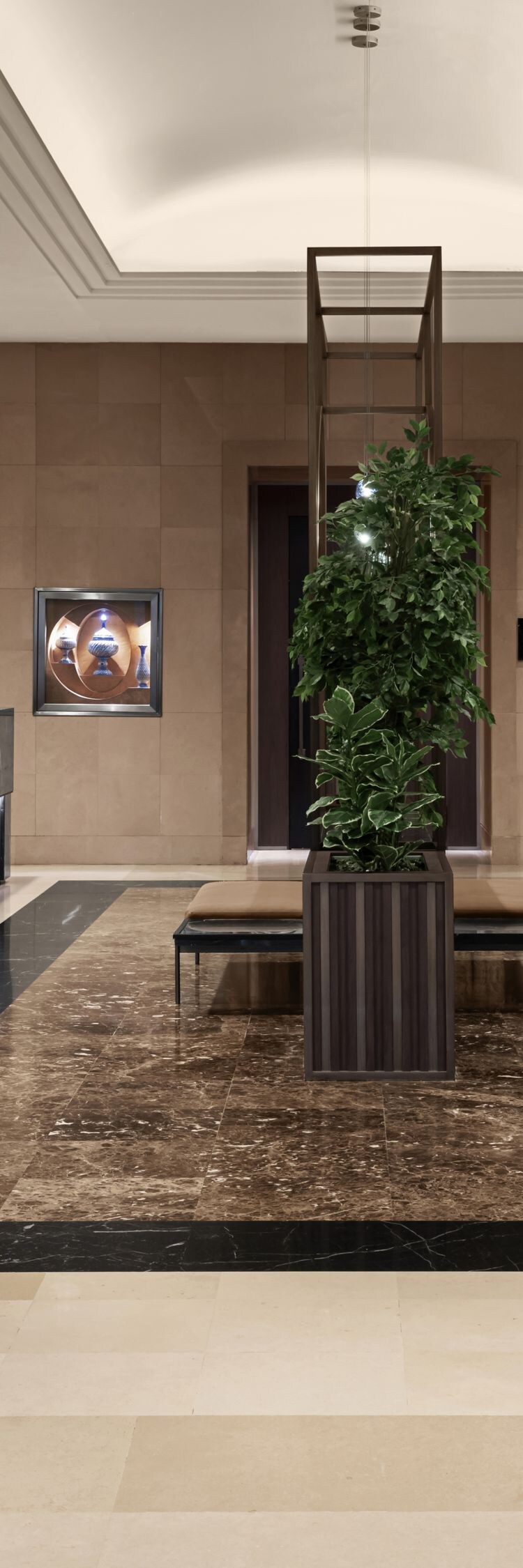Contemporary hotel lobby with polished cream-color