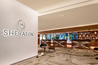 Entrance of hotel with logo and reception area