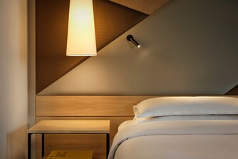 Bed with lamp and bedside table
