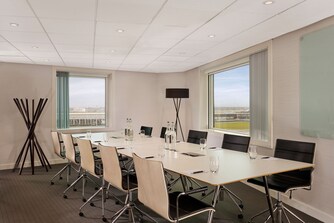 London boardroom set up with airport view