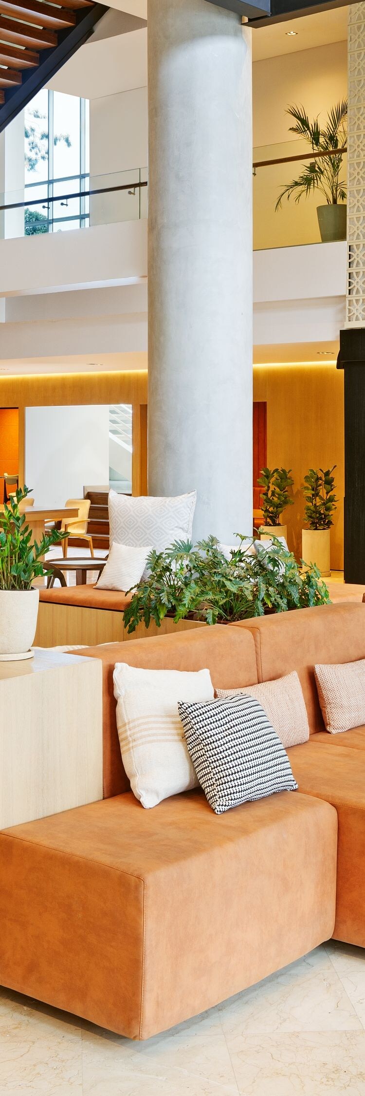 Spacious hotel lobby with seating and front desk
