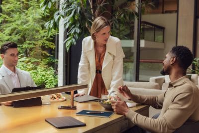 Work colleagues conversing over a meal