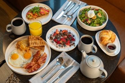multiple plates of a breakfast spread