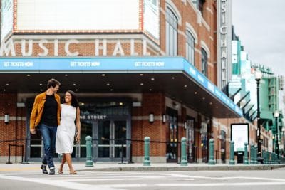 couple walking outside a music hall