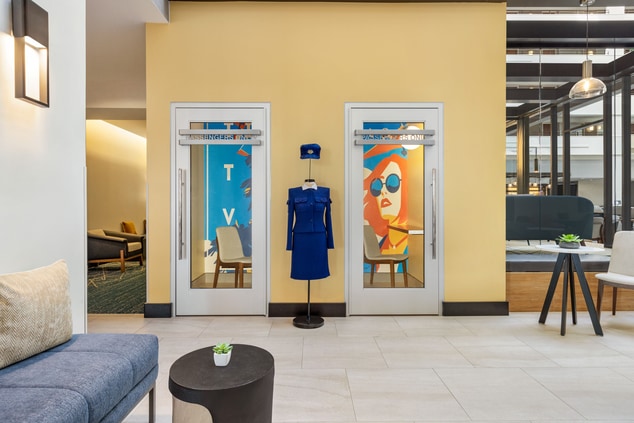 Telephone booths with chairs seen from lobby