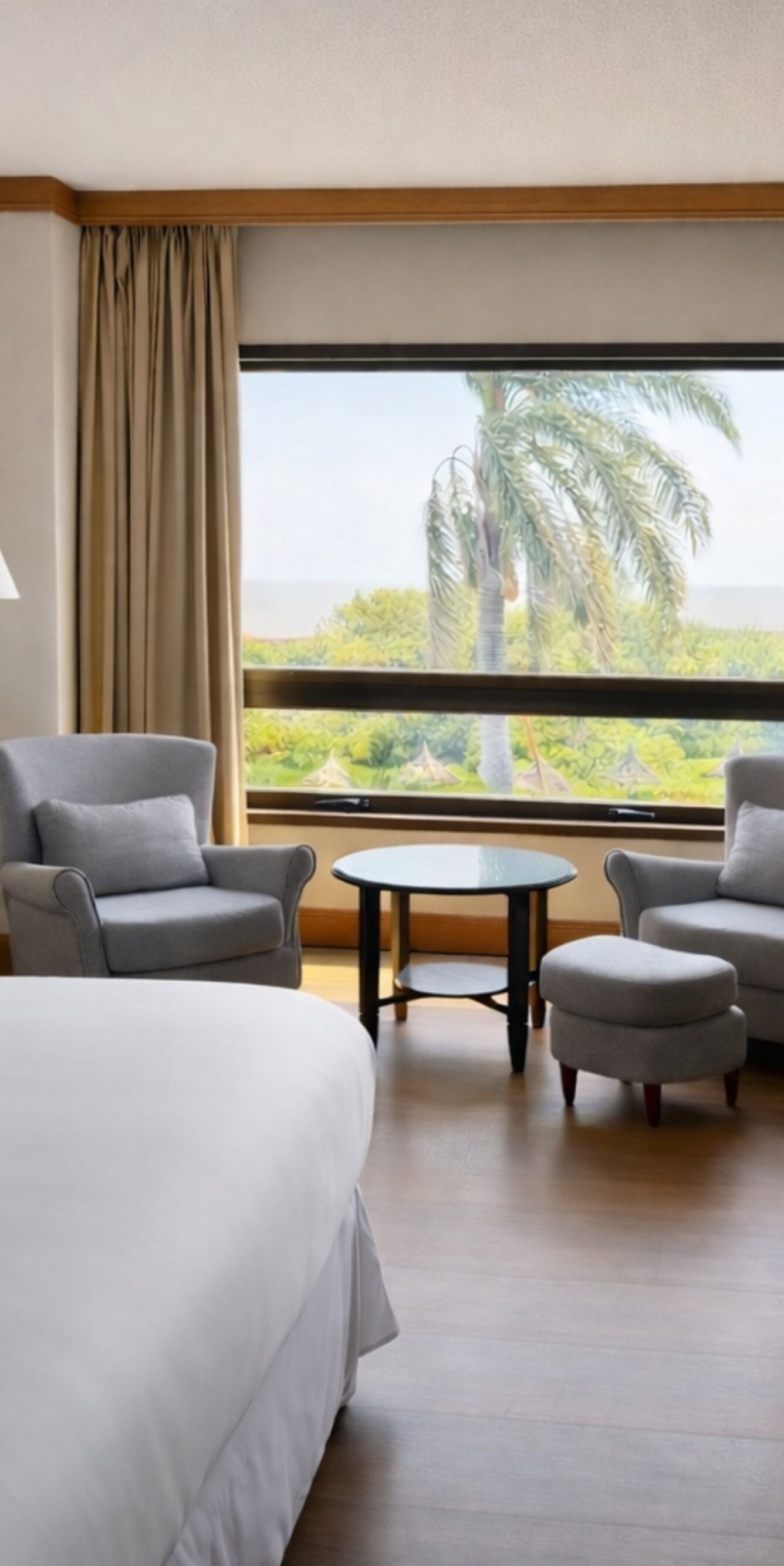 bed, desk, table with two armchairs