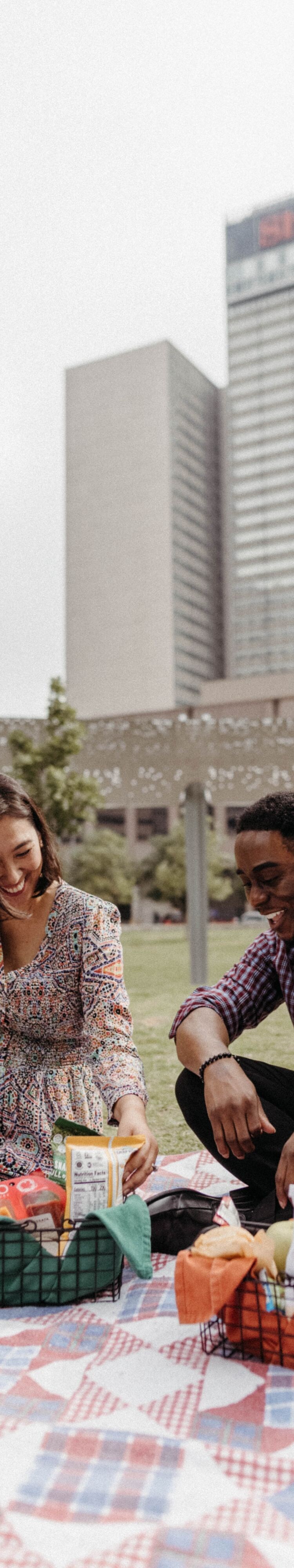 Two people having a picnic outside