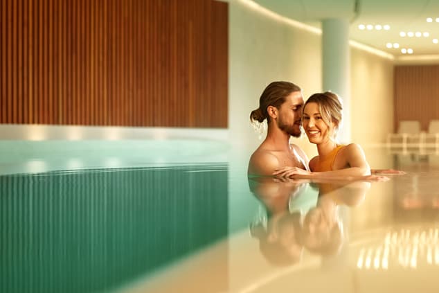A couple in the indoor swimming pool