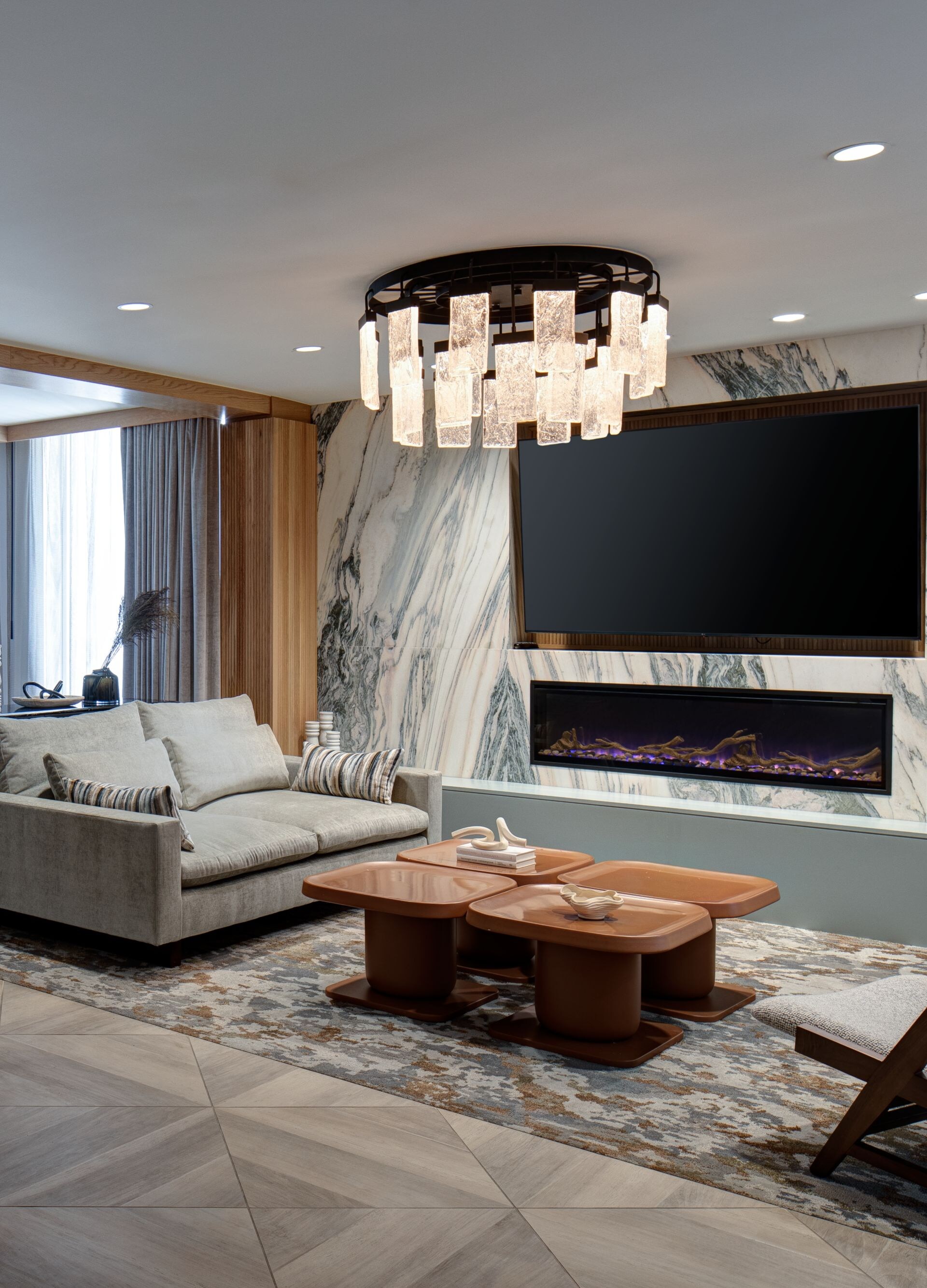 sofas, chairs, tables, and big screen