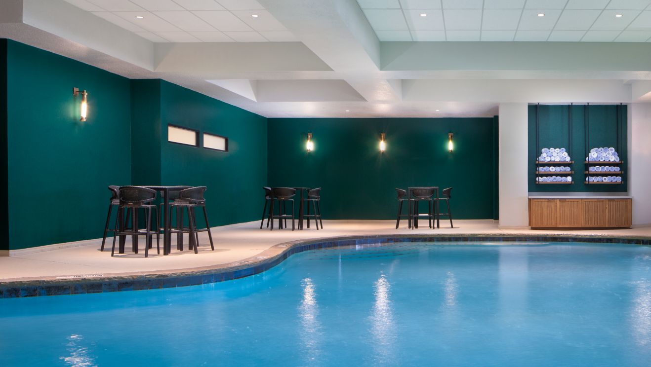Indoor Heated Pool with tables and chairs