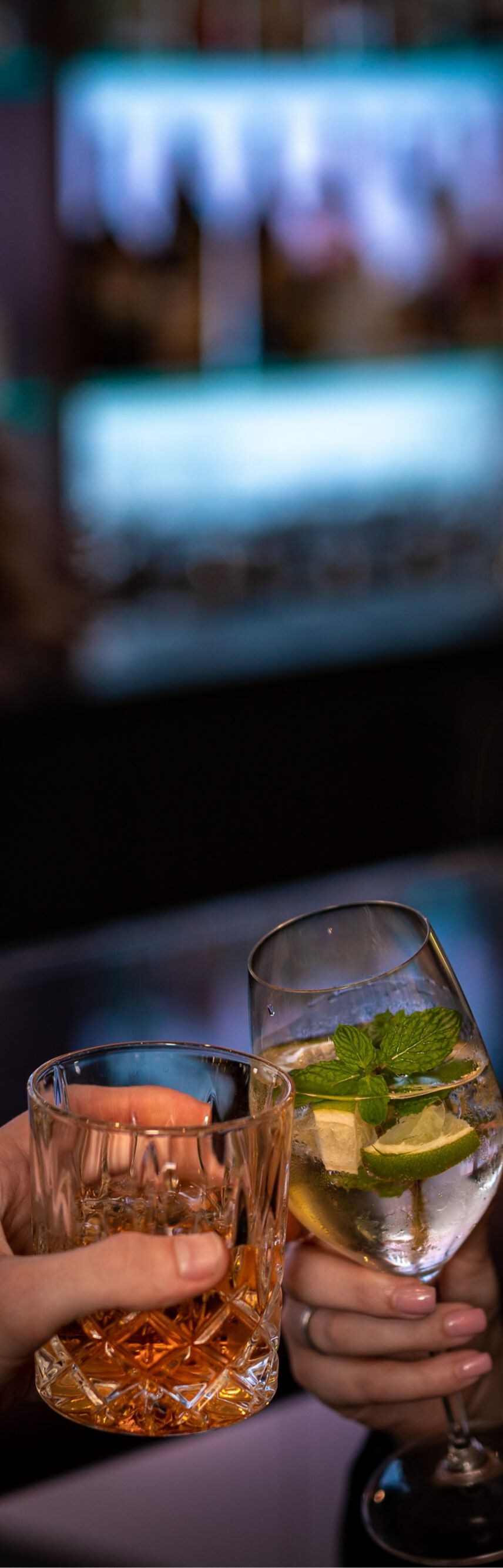 Guests enjoying their drinks at the bar