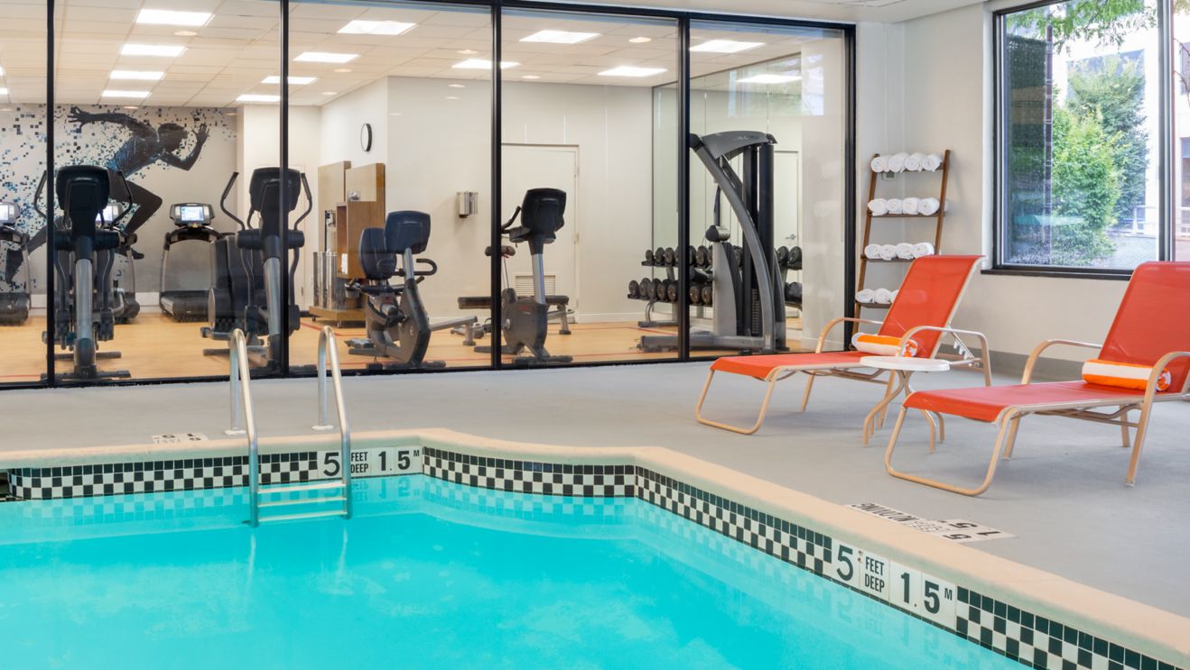 Indoor pool with gym view