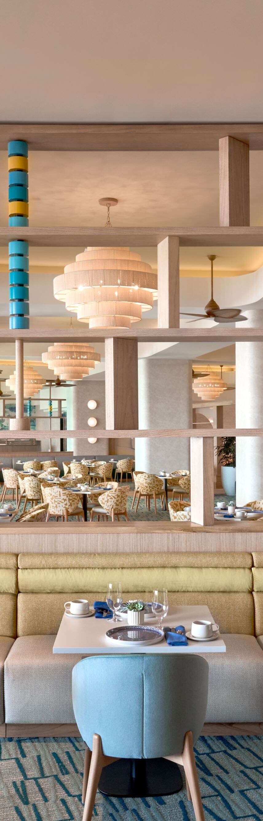 Restaurant interior with blue chairs and shelving
