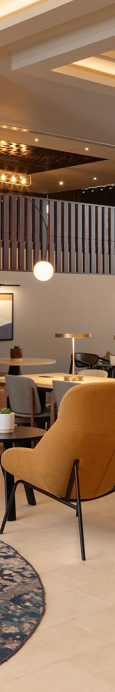 Lobby lounge with leather sofa and pendant lighting
