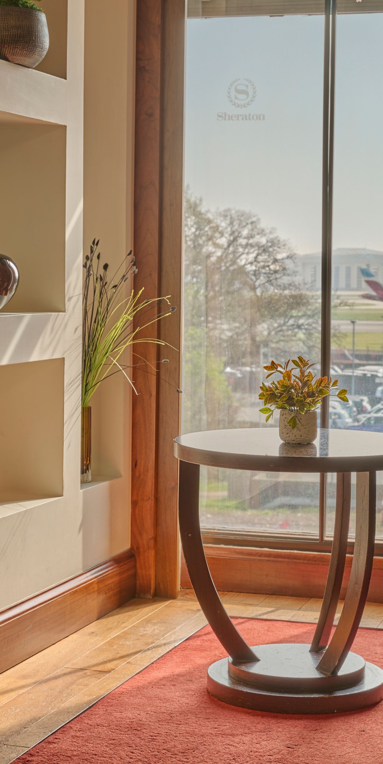 Armchairs beside large windows with panoramic view
