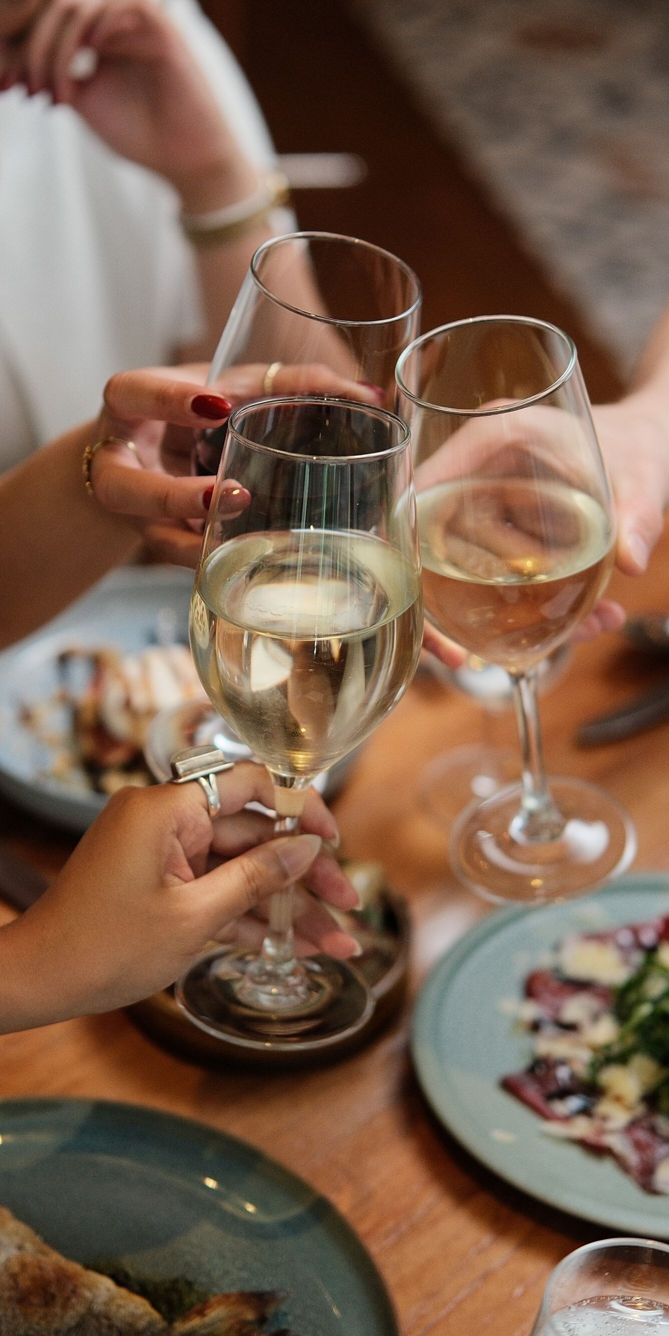 Three glasses of wine above dinner table