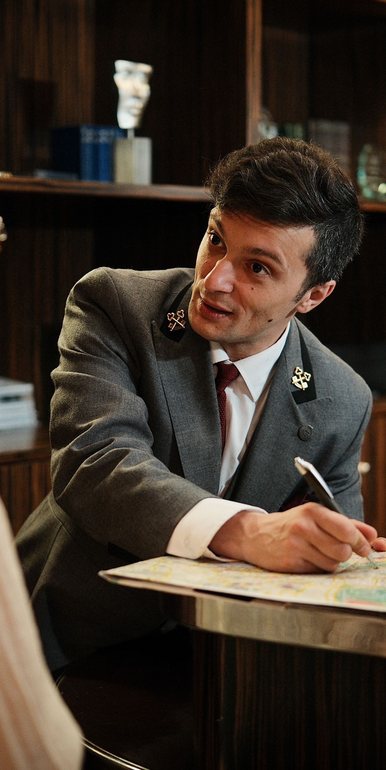 Concierge showing map to guest