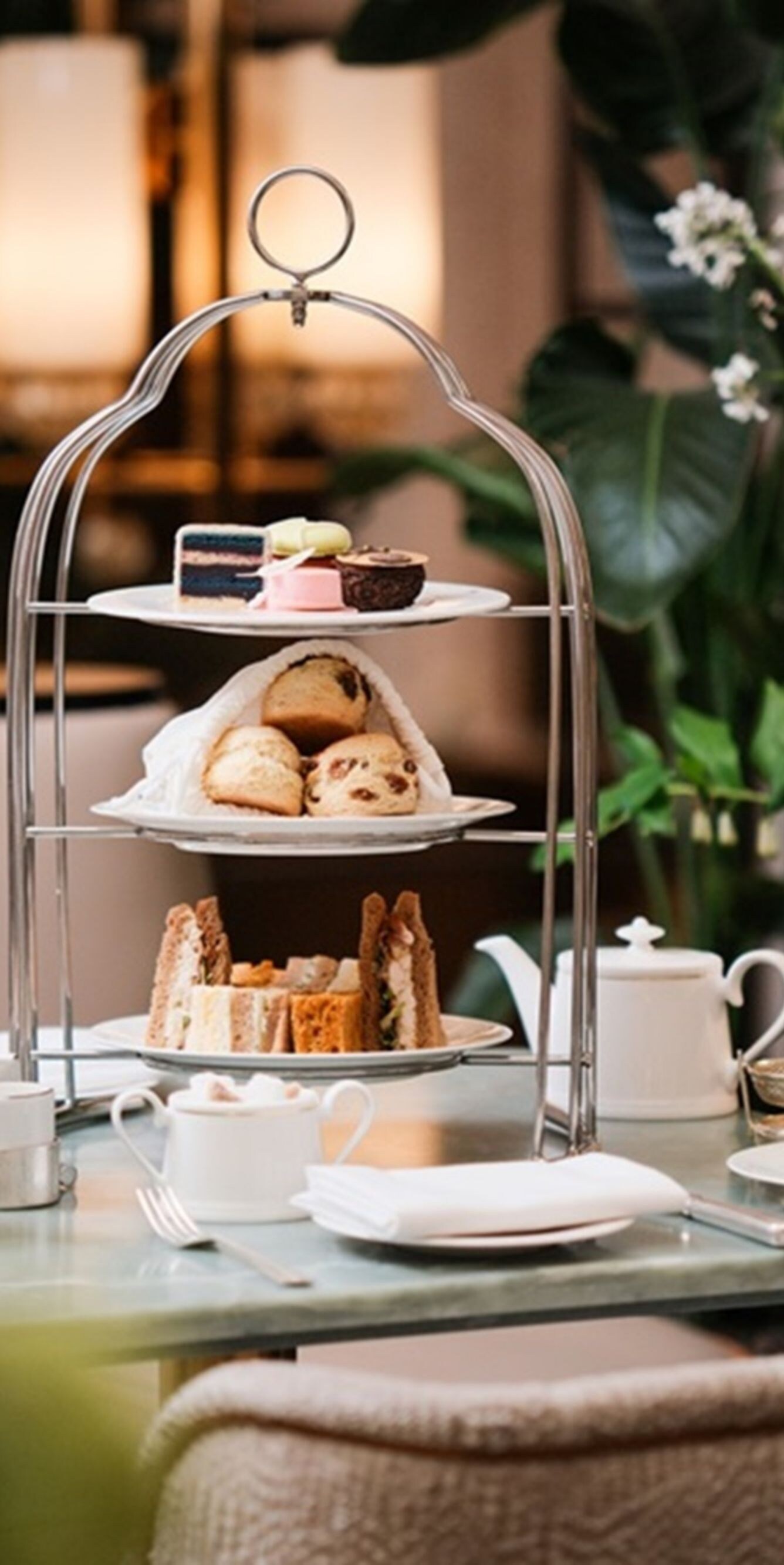 Tiered afternoon tea stand on table