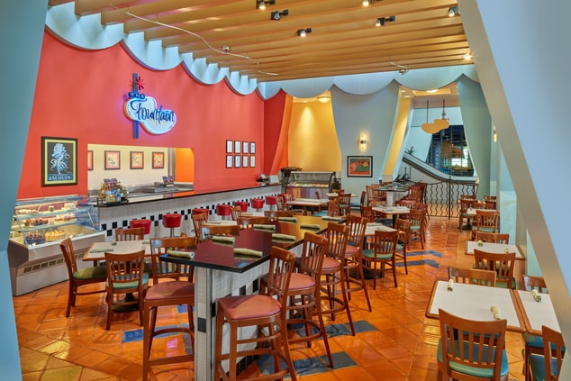 The Fountain restaurant with bright orange walls 