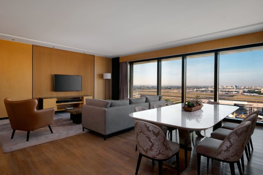 Living room overlooking the airport and city view