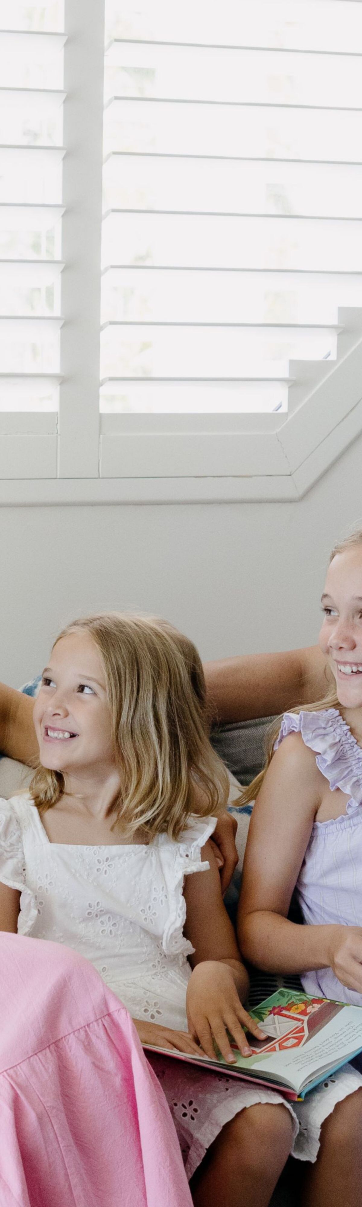 Family siting on couch in villa