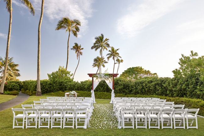 South East lawn wedding ceremony with palm trees