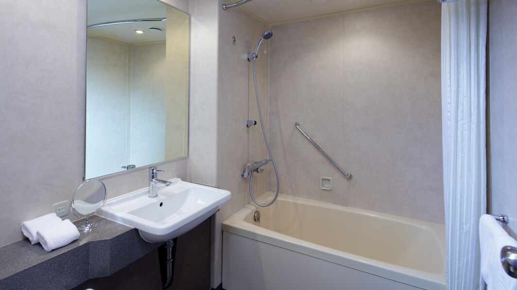 Hotel bathroom with sink and tub