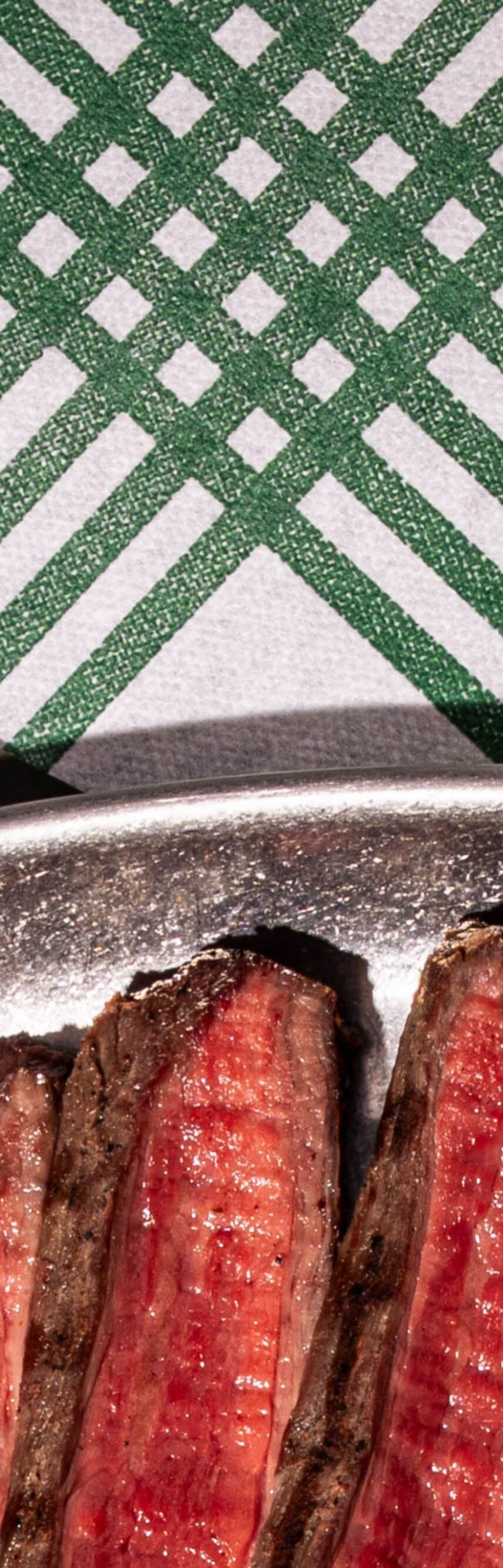 Sliced steak and grilled meat platter