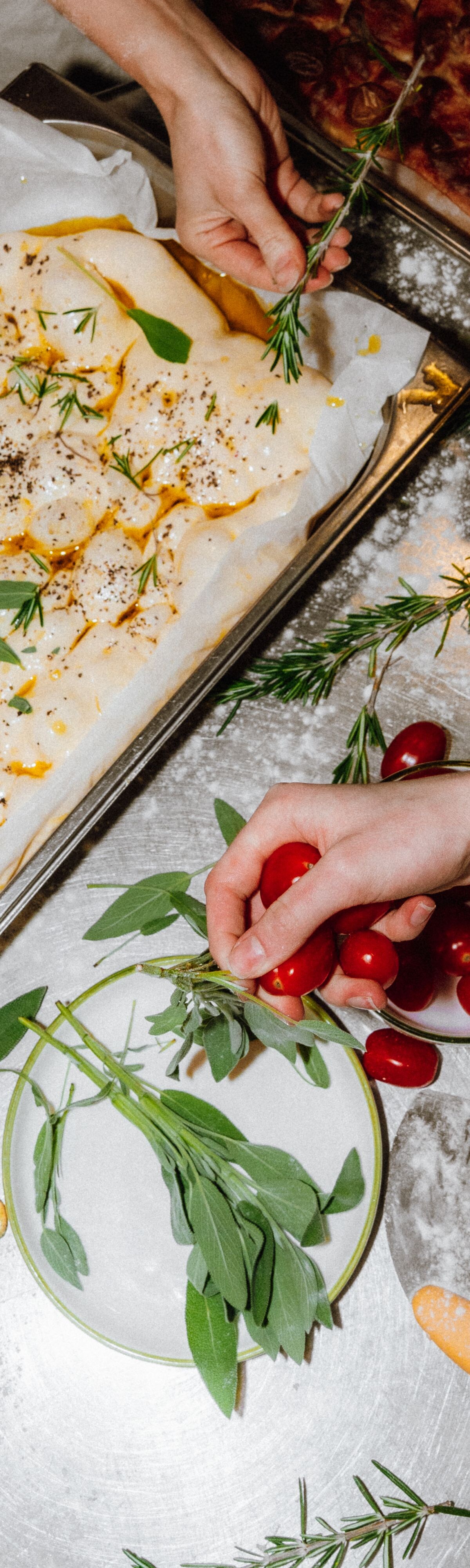 Participants preparing topped focaccia dough